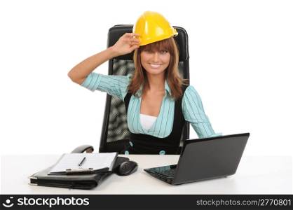 Joyful businesswoman in a helmet in the office. Isolated on white