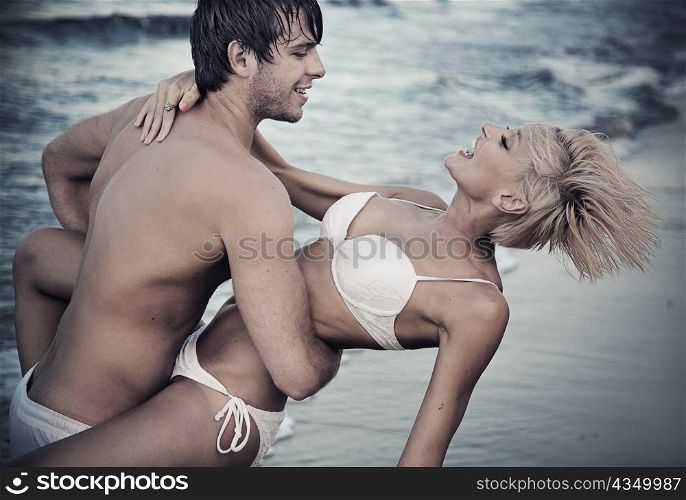 Joyful couple on the beach