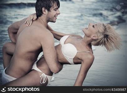 Joyful couple on the beach