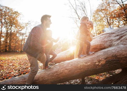 Joyful family enjoying great, autumnal weather