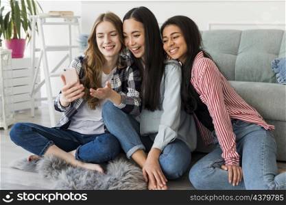 joyful friends taking selfie smartphone