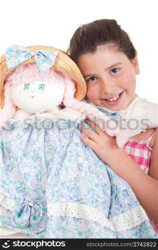 joyful little girl with her favorite doll (isolated on white background)