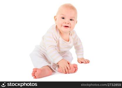 joyful smiling baby is sitting and looking at camera. isolated.