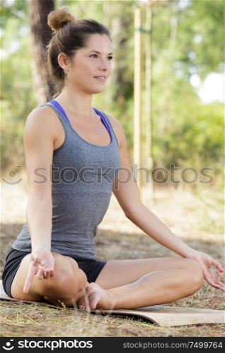 joyful sporty woman practicing yoga positions