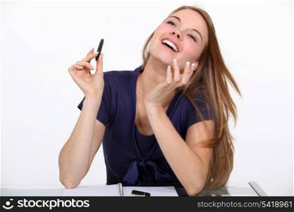 Joyful woman at a desk