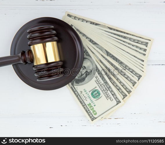 judge gavel and money on brown wooden table concept