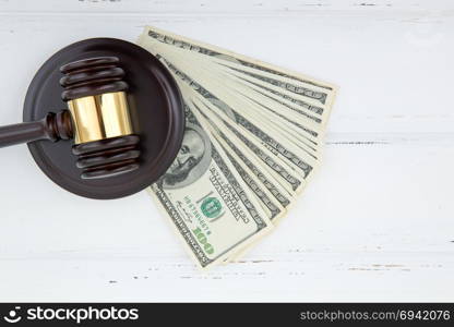 judge gavel and money on brown wooden table concept