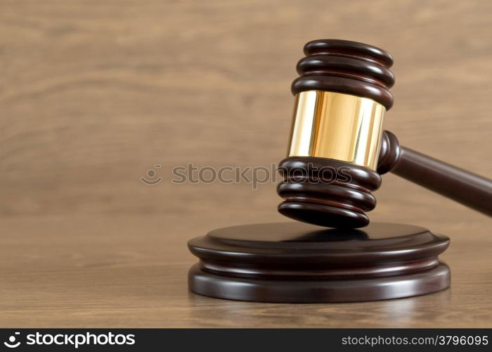 judge gavel on the brown wooden background