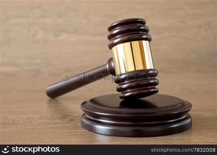 judge gavel on the brown wooden background