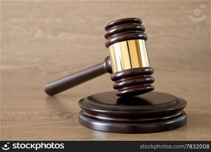 judge gavel on the brown wooden background