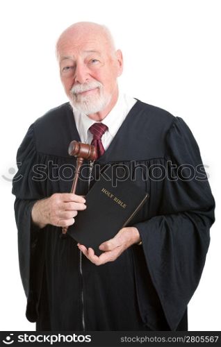Judge holding his gavel and a bible. Metaphor for balancing church and state. Isolated on white.