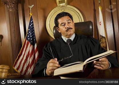 Judge reading in court