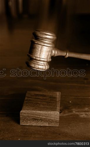 judges gavel coming down and hitting the block gavel blurred for movement