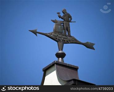 Jueterbog-Schmied. weathervane in the form of a blacksmith on the roof of a house in Jueterbog