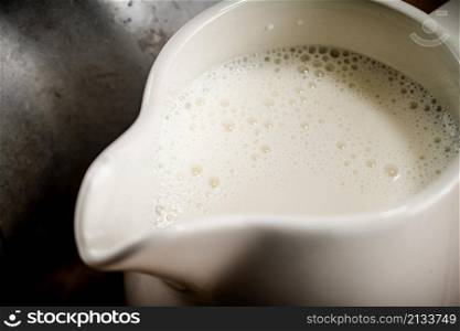 Jug of milk. Macro background. High quality photo. Jug of milk. Macro background.