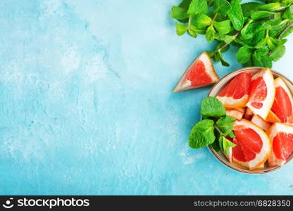 juice and fresh grapefruit on a table