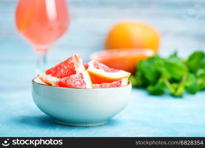juice and fresh grapefruit on a table