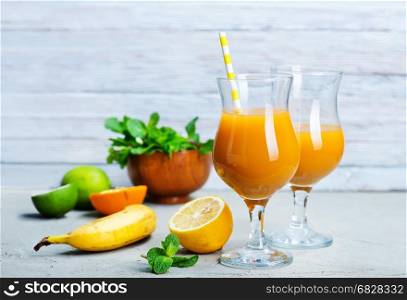 juice from banana and orange on a table