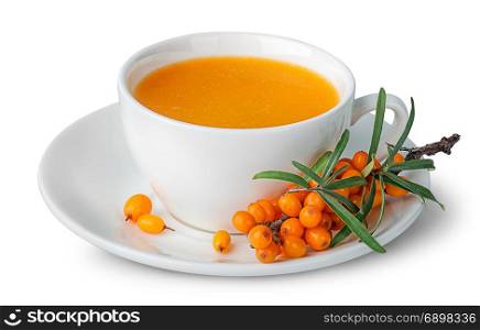 Juice from sea-buckthorn in a cup with berries isolated on white background. Juice from sea-buckthorn in a cup with berries