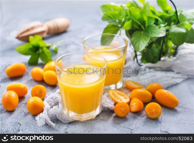juice in glass and on a table