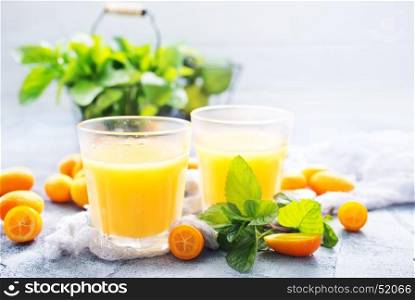 juice in glass and on a table