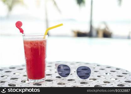 Juice on luxury swimming pool tropical beach resort , summer concept