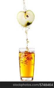 Juice pouring from apple into glass isolated on white background. Juice pouring from apple