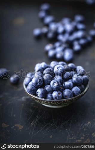 Juicy and fresh blueberries on a beautiful background in a bowl