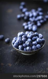 Juicy and fresh blueberries on a beautiful background in a bowl