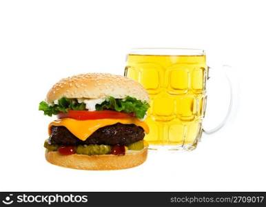 Juicy Angus beef burger topped with cheese, tomatoes & lettuce on a golden sesame seed bun along with a thirst quenching mug of beer. Shot on white background.