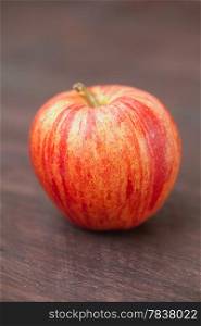 juicy apple on a wooden surface