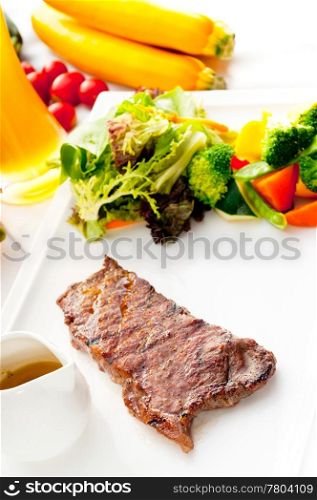 juicy BBQ grilled rib eye ,ribeye steak ,vegetables and lagher beer on background ,MORE DELICIOUS FOOD ON PORTFOLIO