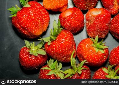 Juicy fresh red strawberry close up background.