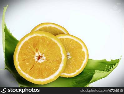 Juicy fruit. Conceptual image with orange against white background