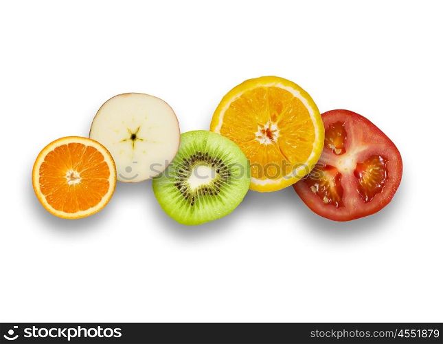 Juicy fruits. Halves of juicy fruits against white background