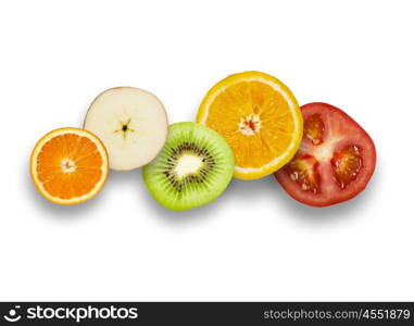 Juicy fruits. Halves of juicy fruits against white background