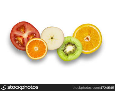 Juicy fruits. Halves of juicy fruits against white background