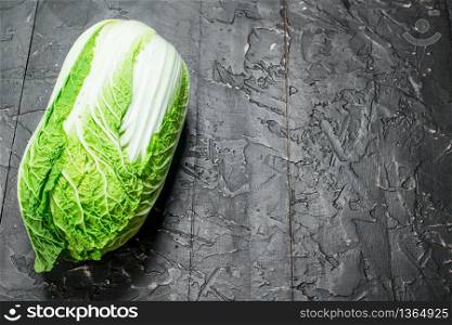 Juicy green cabbage. On rustic background. Juicy green cabbage.