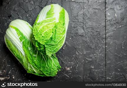 Juicy green cabbage. On rustic background. Juicy green cabbage.