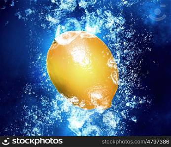 Juicy lemon in water. Lemon fruit in clear blue water splashes
