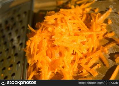 Juicy pile of carrot sliced on grater