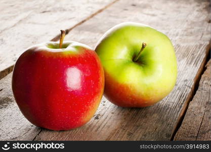 Juicy ripe apples on a wooden background