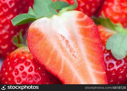 Juicy strawberries photographed together on a white background