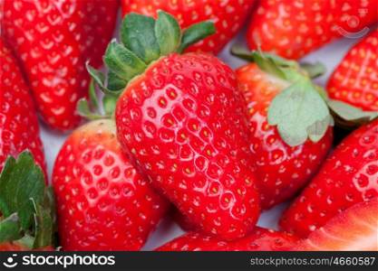 Juicy strawberries photographed together on a white background