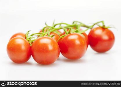 juicy tomatoes isolated on white