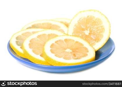 juicy yellow vitamin slices of lemon in blue saucer isolated on white background
