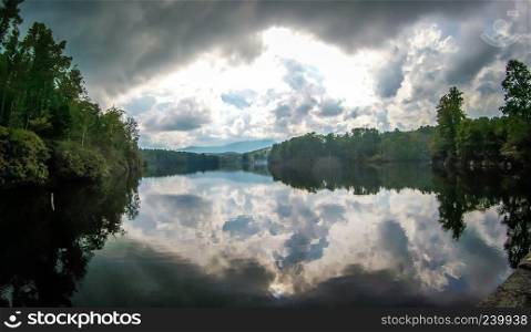 julian price lake with cloudy reflections in summer