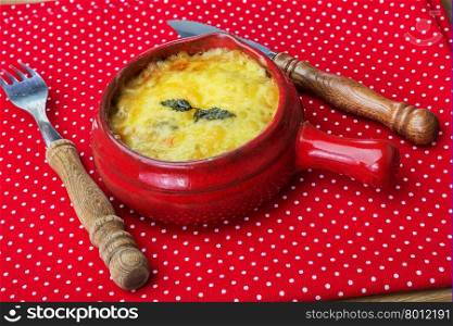 julienne with mushrooms, cream and cheese on red polka dot tablecloth