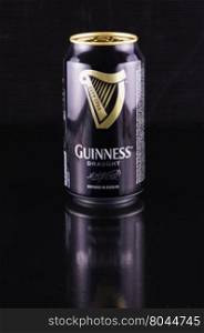July 6, 2016: Guinness beer can over black reflecting background. Guinness is an Irish dry stout produced by Diageo that originated in the brewery of Arthur Guinness at St. James&rsquo;s Gate, Dublin. Guinness is one of the most successful beer brands worldwide