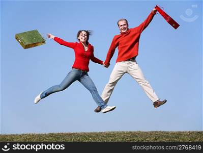jump couple with bags